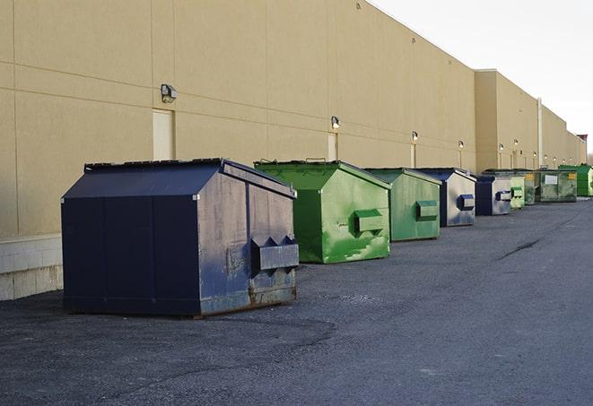 industrial garbage dumpsters filled with discarded materials in Akron